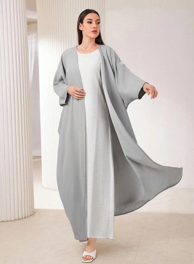 تايك تو عبايةة سادة بأكمام خفاش ومفتوحة من الأمام